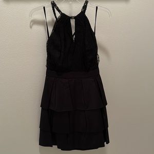 Beaded halterneck tie back pleated black dress